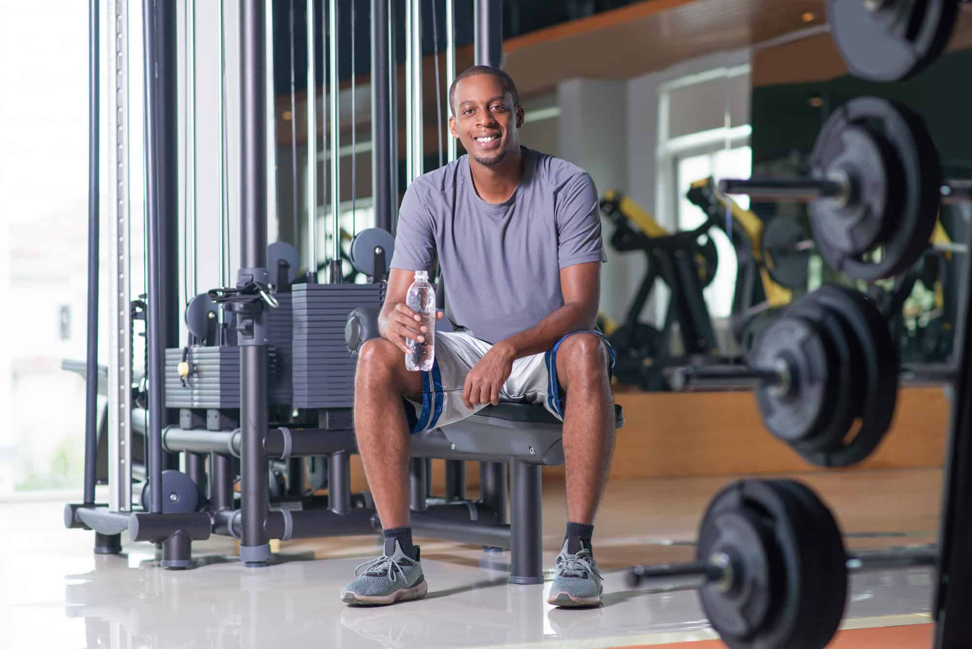 Professional over 40 performing strength training to support health and vitality.