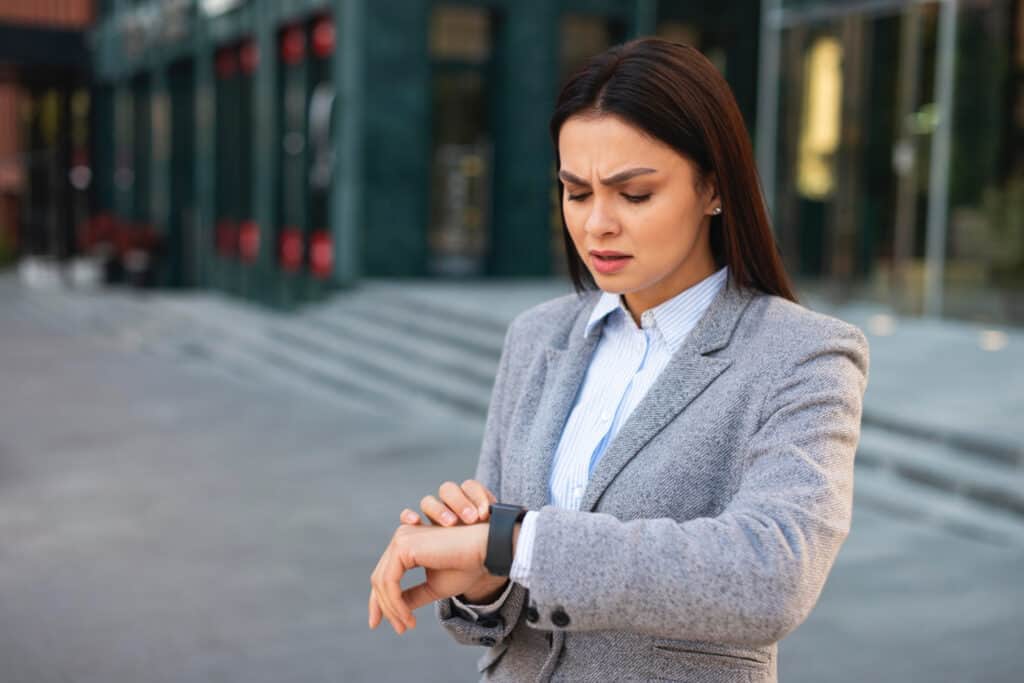 Professional checking pulse as an example of stress impact on the body.