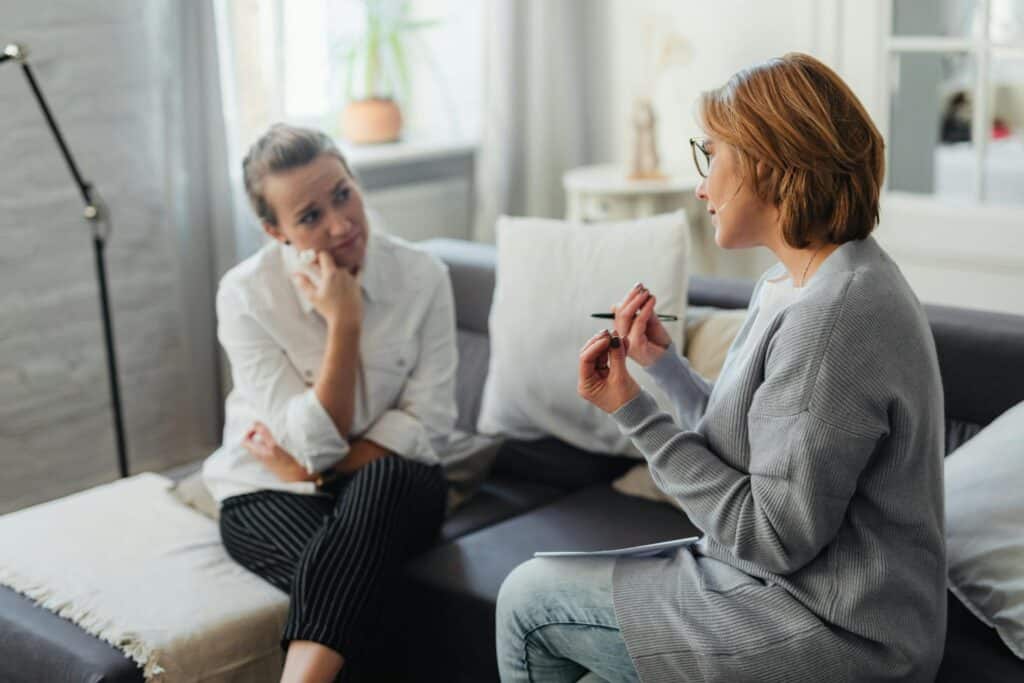 Mentor advising midlife professional, symbolizing guidance for energy management strategies.